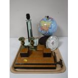 A tray containing art deco desk stand, an art deco bakelite table lamp, a metal Chad Valley globe,