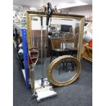 A gilt framed bevel edged overmantel mirror,