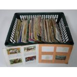 A basket containing tea card albums and cards