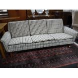 A mid 20th century Danish settee in checked fabric