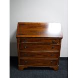 An inlaid yew wood bureau