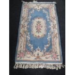 Two Chinese rugs on blue ground