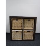 A contemporary storage unit with four wicker drawers