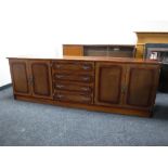 A mahogany effect four door sideboard