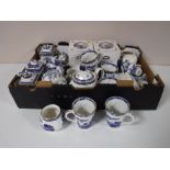 A box containing a quantity of Ringtons willow pattern china