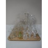 A tray containing assorted cut glass and lead crystal vases, decanters, drinking glasses, etc,