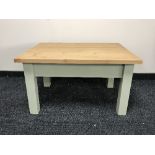 A pine coffee table on painted legs