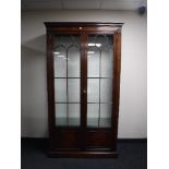 A Chapmans Siesta mahogany double door bookcase