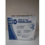 A boxed Jabsco Twist N Lock manual toilet and a glass vase