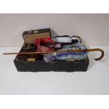 A box containing beaded bag and slippers, jewellery boxes, costume jewellery, walking cane,
