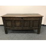 An eighteenth century carved oak coffer,