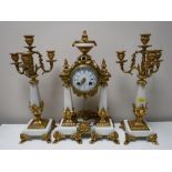 A three piece French white marble and brass clock garniture,