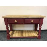 A reclaimed pine two drawer kitchen prep table on painted base