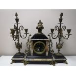 A three piece black slate and marble French clock garniture