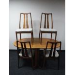 A six piece teak Parker Knoll dining room suite, comprising of display cabinet,