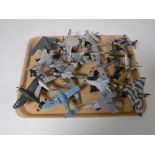 A tray containing twenty die cast airplanes on stands