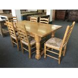 A good quality light oak farmhouse style refectory dining table,