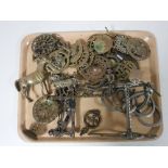 A tray of assorted horse brasses, brass ornaments, horse bit,