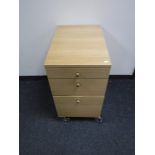 A contemporary office three drawer pedestal chest