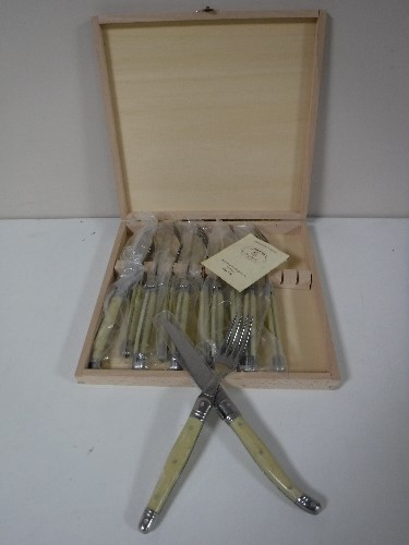 A twelve piece French Laguiole steak knife and fork set,