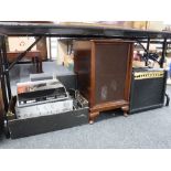 A Marshall amplifier, Technics amp, VCR DVD player, two speaker cabinets with speakers,