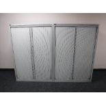 A pair of Triumph metal shutter door cabinets