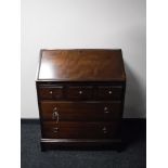 A Stag Minstrel bureau fitted five drawers