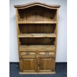 A Mexican pine shaped topped bookcase