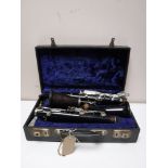 A five piece Boosey and Hawkes clarinet in case with extra parts