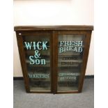 A Victorian and later oak glazed door display cabinet 'Wick & Son Bakers',