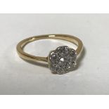 An 18ct gold diamond cluster ring CONDITION REPORT: The ring is in good condition.