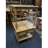 A nest of three 20th century blonde oak tables,
