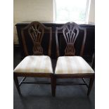 A pair of antique mahogany shield back dining chairs