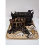 A tray containing four early twentieth century wooden pipe stands,