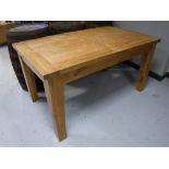 A contemporary oak refectory dining table