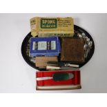 A papier mache tray containing a vintage boxed Spong mincer,