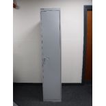 A Bisley single door locker with key