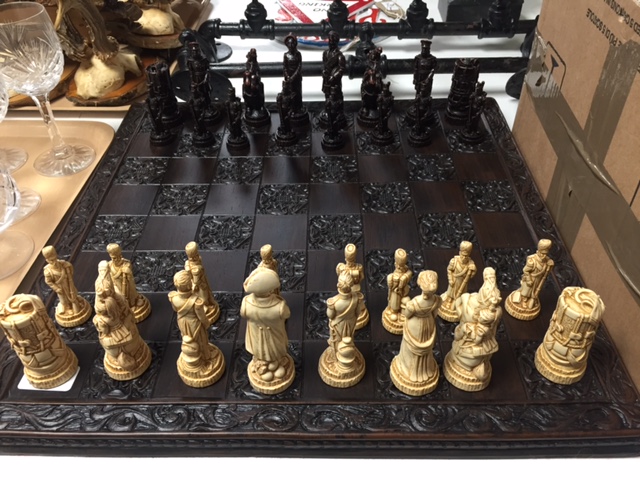 A Waterloo chess set and board in un-used condition, boxed.