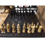 A Waterloo chess set and board in un-used condition, boxed.