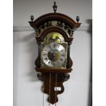 A brass faced mahogany wall clock,