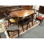 A Victorian mahogany wind out dining table on claw and ball feet,