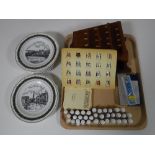 A tray of collection of china thimbles and stands, three collector's spoons,