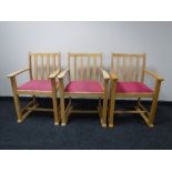 A set of eleven beech framed armchairs