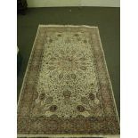 An Indian floral rug on ivory ground