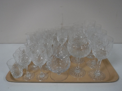 A tray containing a quantity of cut glass drinking glasses