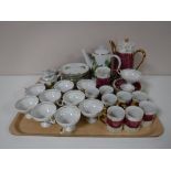 A tray containing two continental tea services