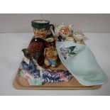 A tray containing a Royal Doulton 'Mr Pickwick' character jug, art deco figurine, Carlton ware dish,
