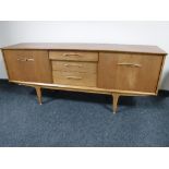 A mid 20th century teak sideboard