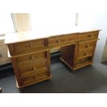 A pine twin pedestal dressing table,