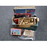 Three boxes containing assorted china records, wooden games, kitchen ware,